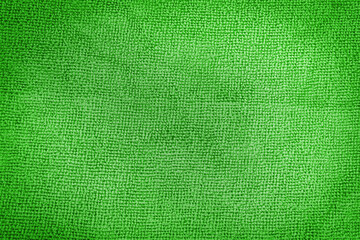 Green canvas background. The surface of the texture of the green fabric.