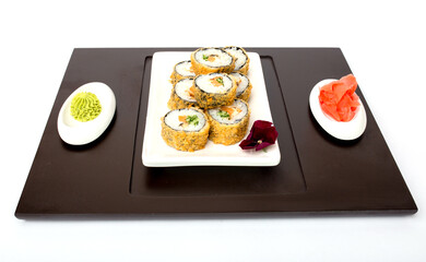 Sushi rolls Japanese delicacies. Japanese traditional rice and fish dishes. Beautiful serving food on a light background with copy space. A set of delicious goodies.