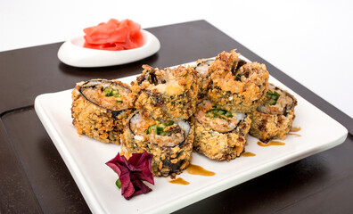 Sushi rolls Japanese delicacies. Japanese traditional rice and fish dishes. Beautiful serving food on a light background with copy space. A set of delicious goodies.