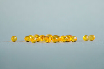 Vitamin D ( omega 3 ) capsules on a light background. Copy space.