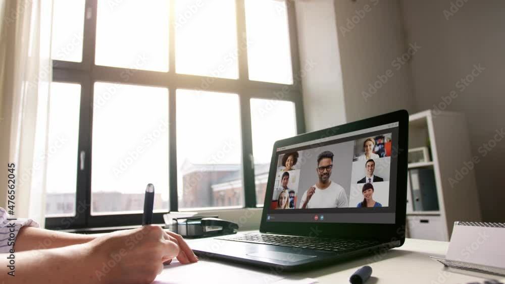 Wall mural remote job, technology and people concept - young businesswoman with laptop computer and papers working at home office and having video conference