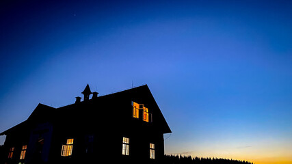 beautiful night and one of the cottages of hamlet Jizerka in the Jizera Mountains, Czech Republic © MarkeVyd.