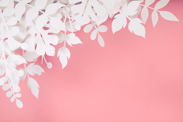 Trendy pink colored scene with handmade paper cut jungle plants leaves decor. Cosmetics or beauty...