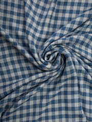 Close up of texture of hand woven plaid shawl, Thai cotton indigo dyed.