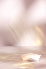 Abstract surreal scene - empty stage with white polygonal podium on pastel pink and gold colored...