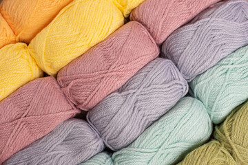 Close Up of yarn balls. Rainbow colors. Yarn for knitting. Skeins of yarn. Knitting needles,...
