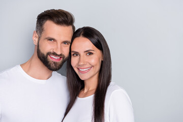 Photo of nice young couple hug wear white shirt isolated on grey color background - Powered by Adobe