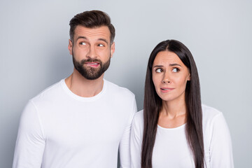 Photo of scared brother sister dressed white shirts biting lips looking empty space isolated grey color background - obrazy, fototapety, plakaty