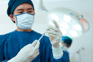 Team of doctors wearing protective clothing works together to monitor patients in Bright Modern...