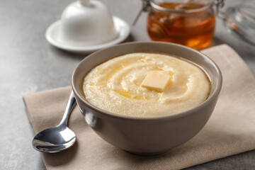 Delicious semolina pudding served on grey table