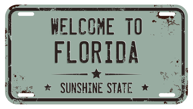 Welcome To Florida Message On Damaged License Plate