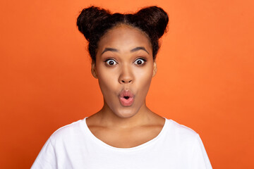 Photo of young astonished african girl unexpected news face reaction discount isolated over orange color background