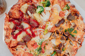 Pizza filled with cheese and various toppings.