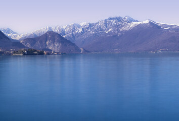 early morning panorama on calm lake, winter landscape of italian lakes.Lake Maggiore,Italy.