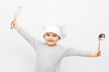 Fototapeta premium Happy little chef with a whisk, on white background.