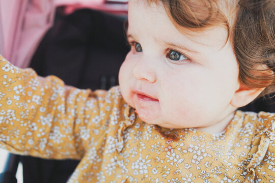 Lovely little girl dirty of strawberries