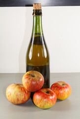 Cider bottle and apples