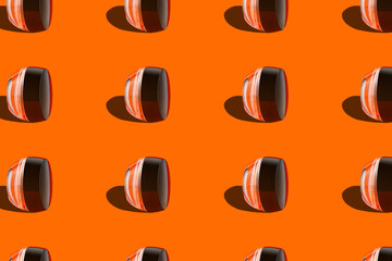 Makeup pattern face cream tonal foundation glass jar geometrical podium orange background....