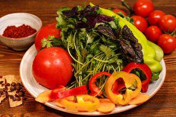 Organic fresh vegetable salad with cherry tomatoes, red and green peppers and mixed greens