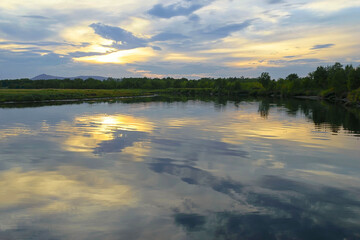 Idyllic sunset on the Iska river. Natural spawning ground for paciic salmon. Khabarovsk Krai, far East, Russia.