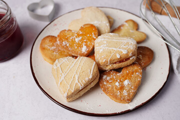 Glazed heart shaped cookies for Valentine's day - delicious homemade natural organic pastry, baking with love for Valentine's day