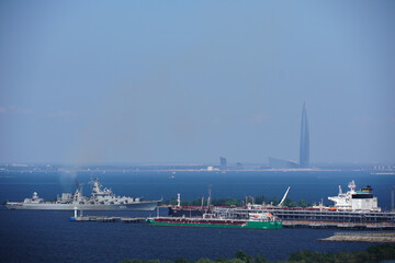 a warship in the port of St. Petersburg. Oil tanker. Gulf of Finland. Lakhta Center skyscraper in...