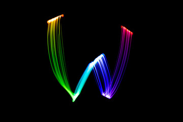 Letter W. Isolated figure on a black background. Freezelight.