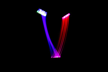Letter V. Isolated figure on a black background. Freezelight.
