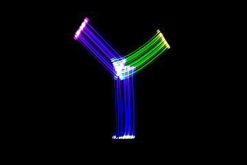 Letter Y. Isolated figure on a black background. Freezelight.