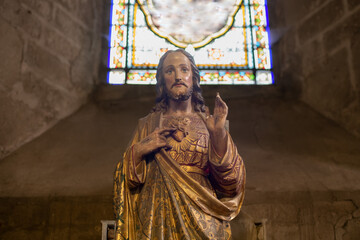Statue of Jesus with a red heart