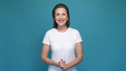 Delighted lady fist up celebrate aim achieve isolated blue color background