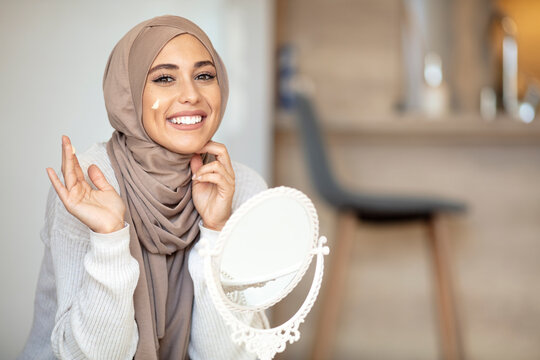 Muslim Woman Applying Makeup