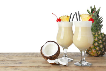 Tasty Pina Colada cocktail and ingredients on wooden table against white background, space for text - obrazy, fototapety, plakaty