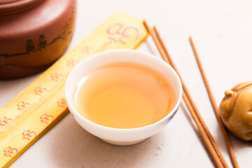 Tea ceremony, fresh tea. Traditional teapot and teacup.