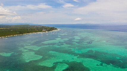 Aerial seascape with beautiful tropical beach. Panglao, Philippines. Alona beach. Summer and travel vacation concept.