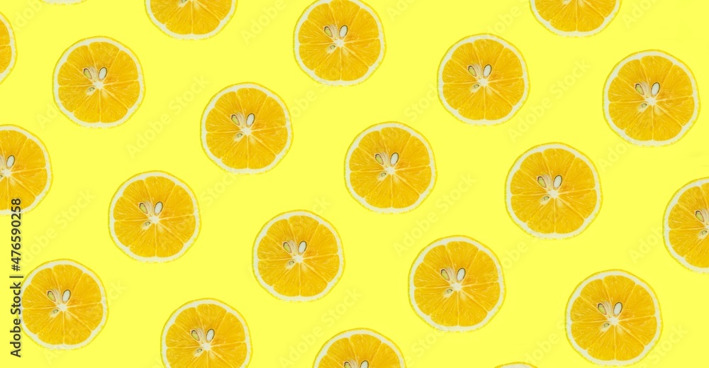 Poster lemon slices pattern, top view of lemon slices isolated on a yellow background.