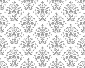 Wallpaper in the style of Baroque. Seamless vector background. White and gray floral ornament. Graphic pattern for fabric, wallpaper, packaging. Ornate Damask flower ornament.