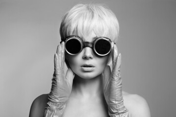 beautiful blond hair woman in gloves and sunglasses