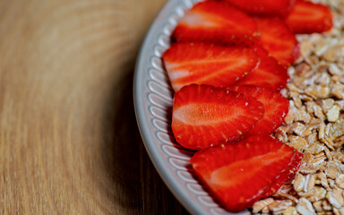 High resolution: Oat flakes with sliced straweberries