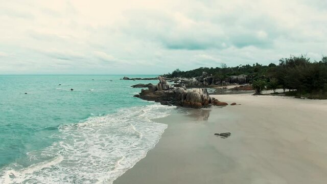 Rambak beach, one of the most beautiful beaches in Bangka Belitung, Indonesia | aerial drone footage videography 4k