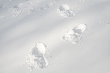 Shoeprints in snow - danger walking in the snow.