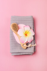 Face Brush made of Bamboo with Gray Towel Pink Background SPA no Plastic Concept Minimalism Vertical