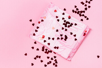 Menstrual Pad with Red Glitter on Pastel Pink Background Minimalist still life concept