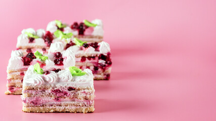 Pieces of Tasty Homemade Biscuit Cake on Pink Background Tasty Dessert with Cream Horizontal