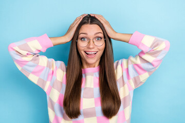 Fototapeta premium Photo of glad positive amazed lady hands head sale omg reaction wear specs sweater isolated blue color background