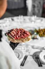 waiter holds tray with food. Restaurant service. buffet or catering.