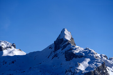Panoramic view of mountains seen from mountain Klingenstock on a sunny winter day. Photo taken December 20th, 2021, Stoos, Switzerland.