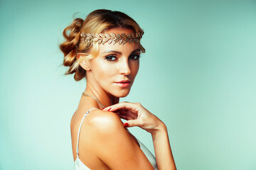 young blond woman dressed like ancient greek godess, gold jewelry close up isolated, beautiful girl...