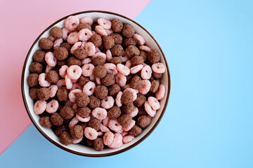 Corn flakes different shapes chocolate and strawberry. Corn flakes as a breakfast variant
