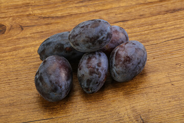 Purple sweet ripe plum heap